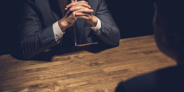 Detective Interviewing Suspect Dark Room | Legal Advice Guru