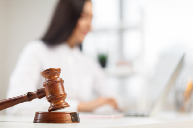 wooden gavel table attorney working court | Legal Advice Guru
