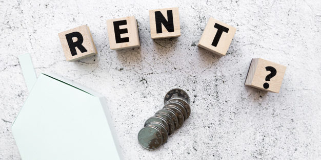 Rent wooden blocks with question marks coins blue paper house model concrete background | Legal Advice Guru